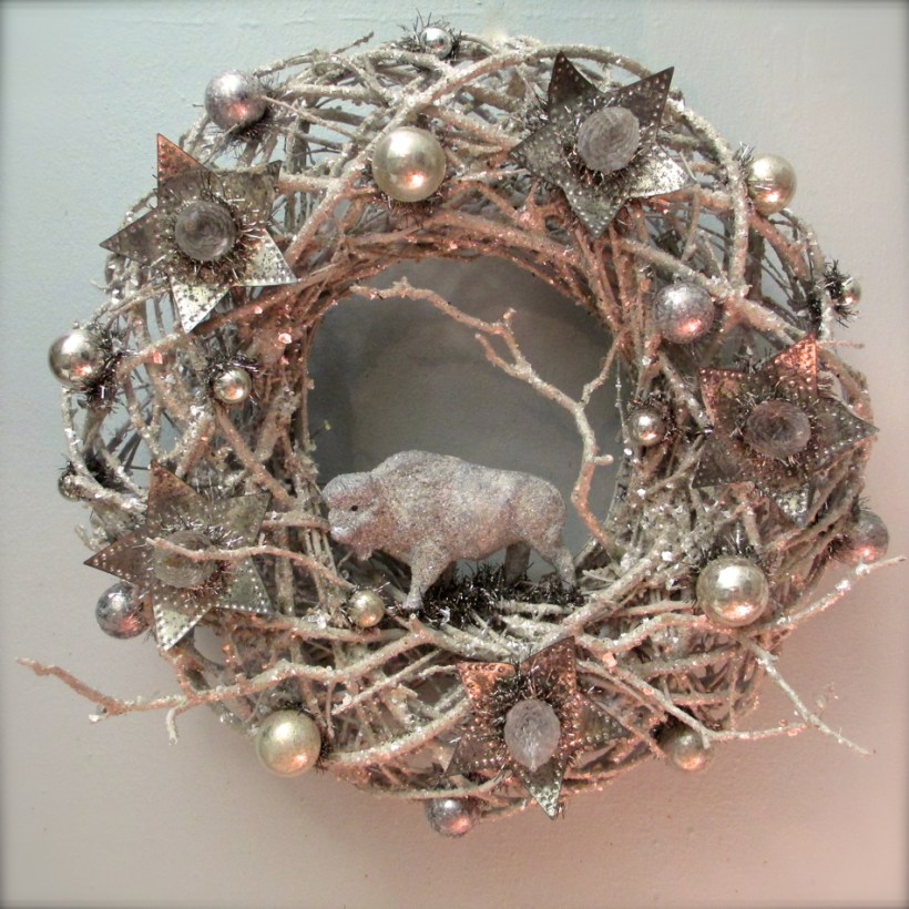 Bison Wreath with vintage composition toy, excavated pinecone light bulbs circa 1920, and 1930's metal light reflectors.