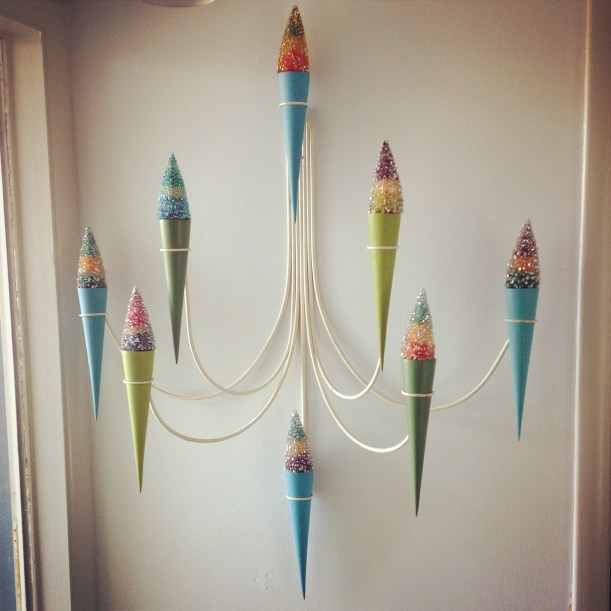 1950's Peter Pepper Products candle sconce with striped vintage bottle brush trees.